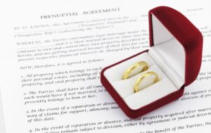 wedding rings on a prenuptial agreement form