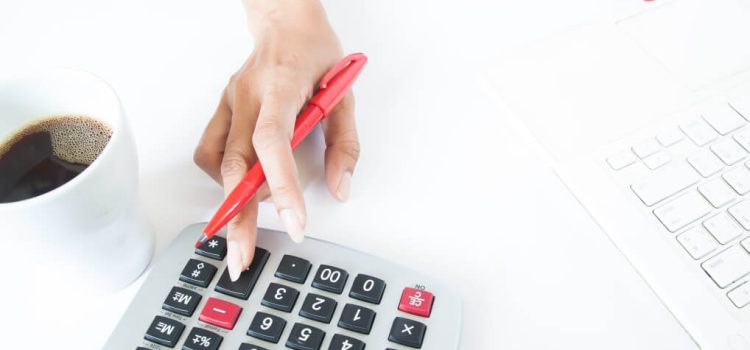 business-woman-using-calculator-and-laptop-on-white-desk-accounting-and-tax-concept_t20_NQPdQn (1)